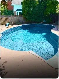 Backyard pool after liner replacement, clear water and modern look